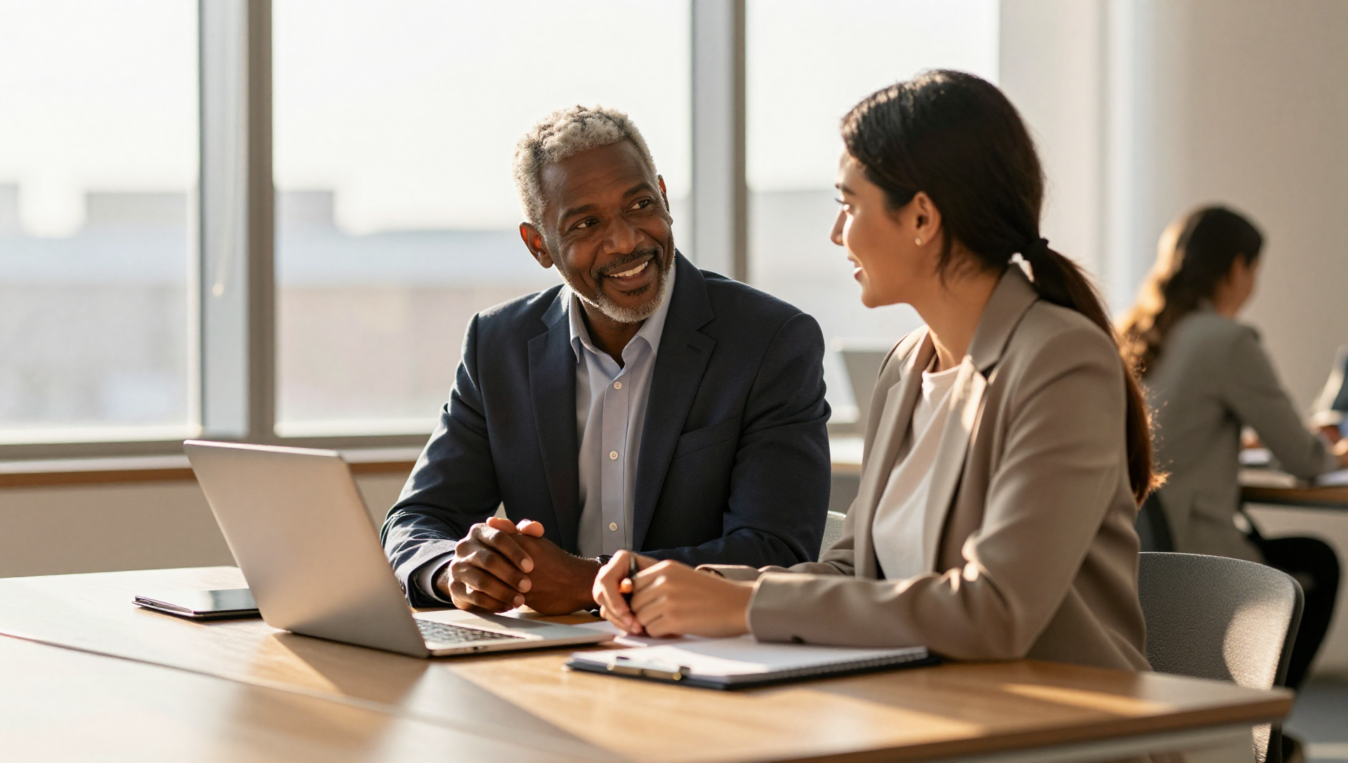 A seasoned professional mentoring a young business owner in a warm co-working space